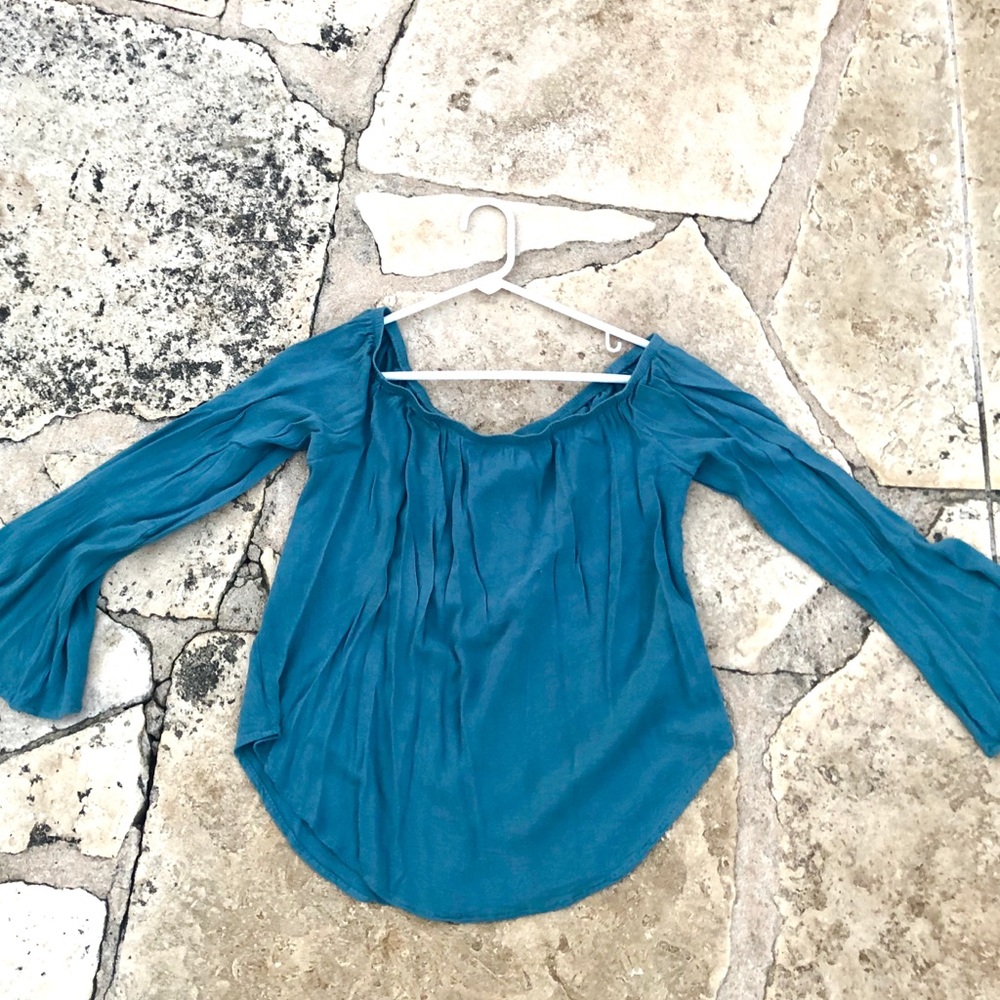 Off the shoulder long sleeve shirt.